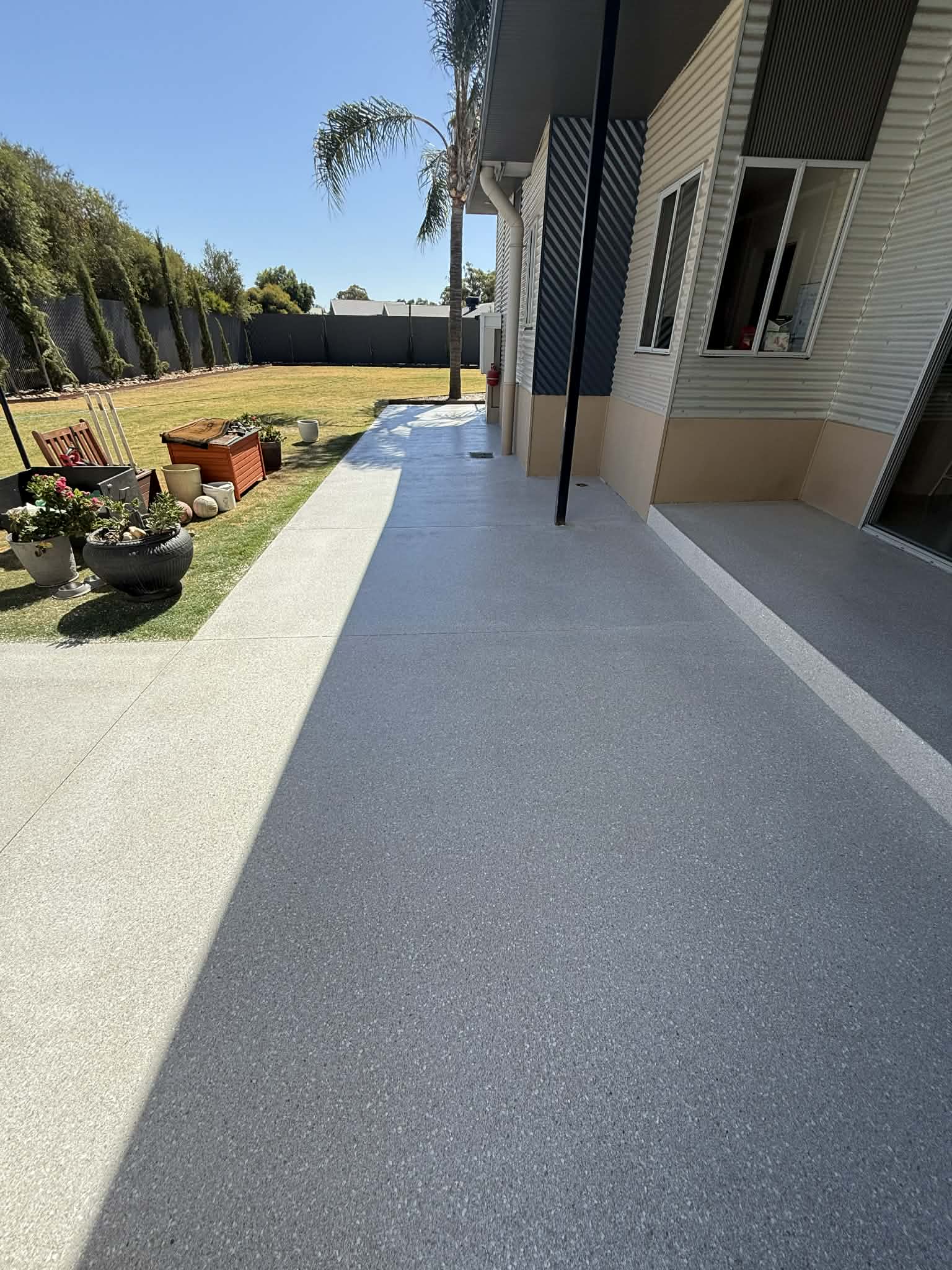 Outdoor coated concrete pathway